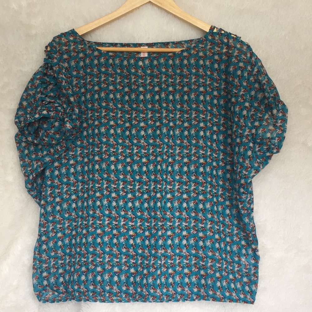 Sheer floral top with cross-stitch sleeves